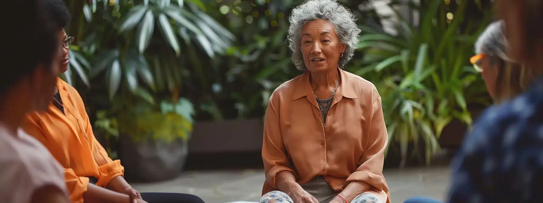 a therapist speaking at a local event, surrounded by engaged community members.