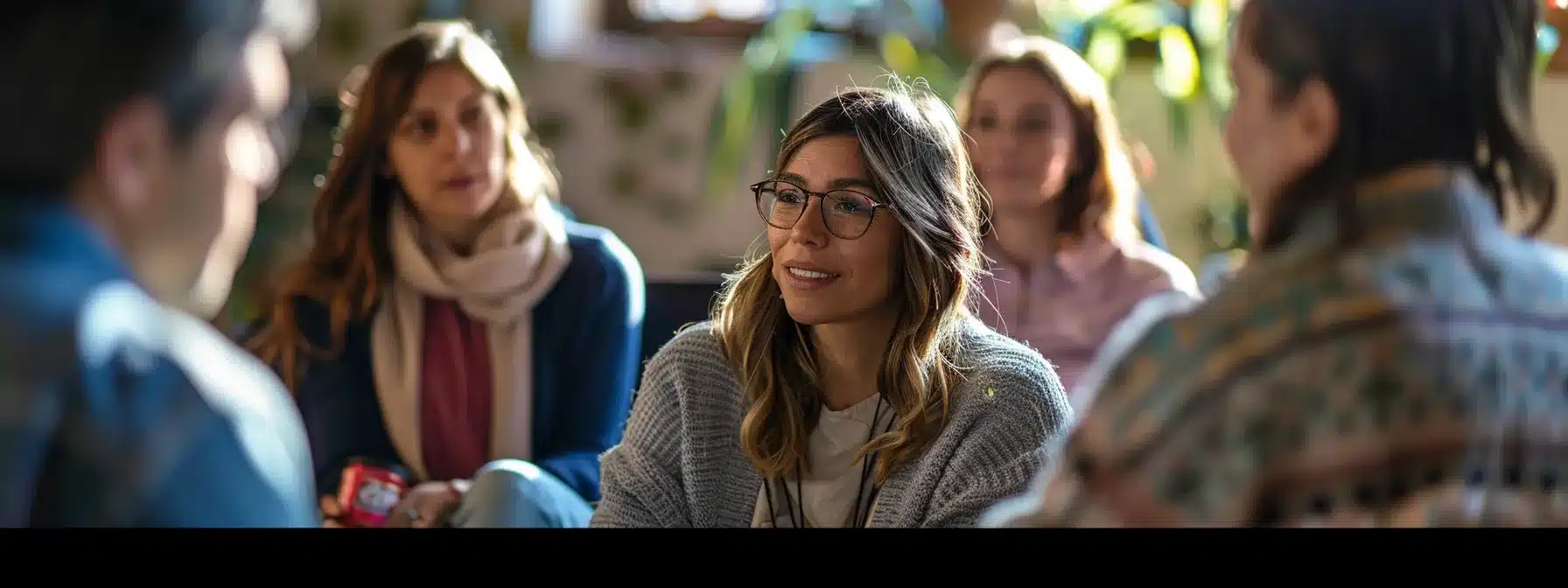 a therapist interacting with a diverse group of community members at a local event, displaying dedication and active engagement.