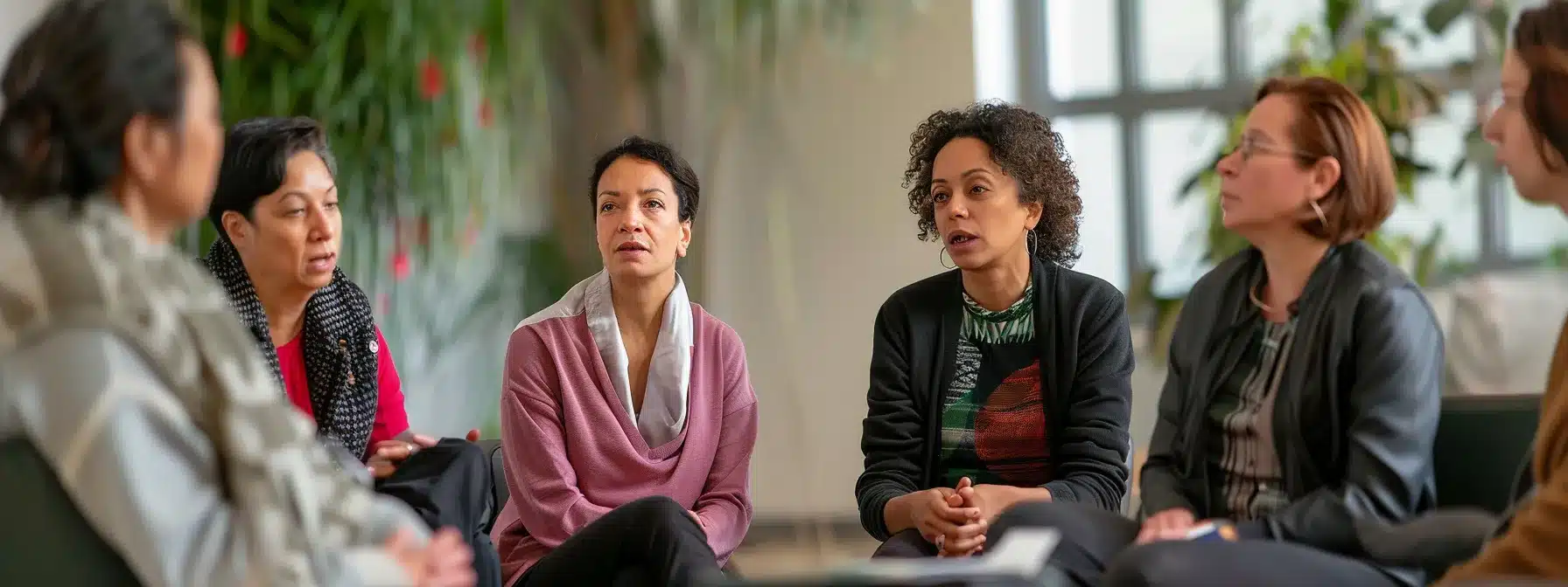 a therapist engaging with a diverse group of locals at a community event, sharing resources and discussing mental health support, embodying a strong sense of community connection and trust.