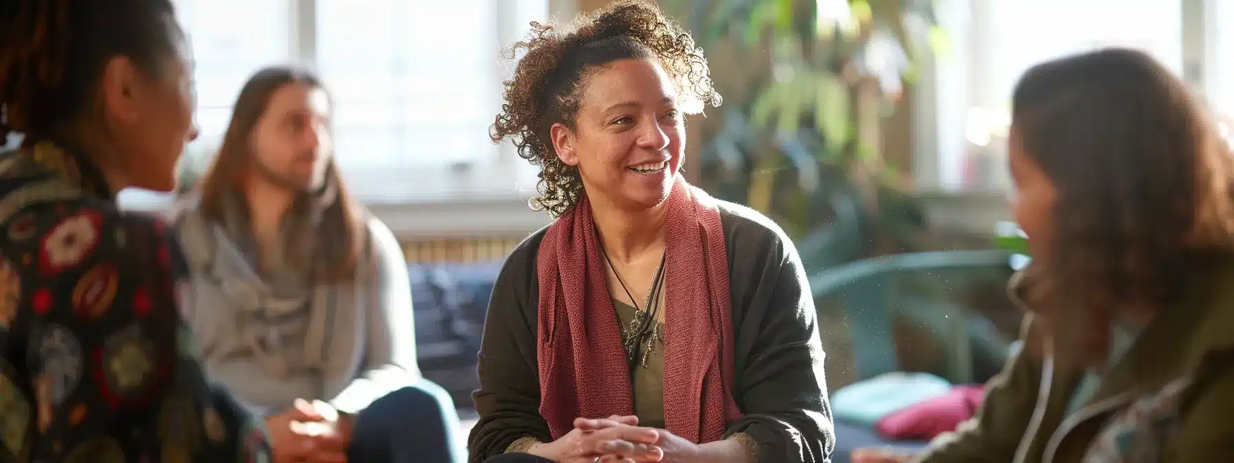 a therapist interacting with locals at a community event, engaging in discussions and sharing information about their practice to build connections and trust in the community.